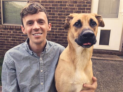 Picture of the media specialist and his dog